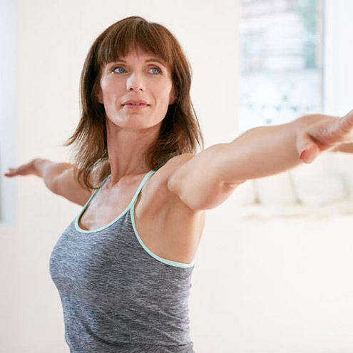 mid-aged woman with endometriosis is exercising